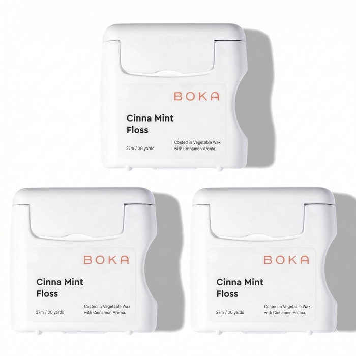 Three packages of Boka Cinna Mint Floss on a white background