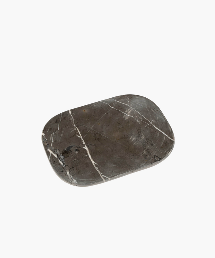 A rectangular beige marble tray with natural pattern variations.
