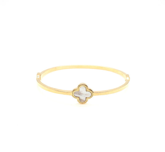 Gold cuff with a mother of pearl clover in center. Cecilia bangle