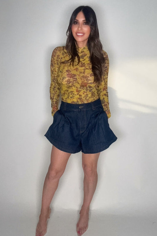Dark wash high-waist denim shorts with camel contrast stitching, front pleats, button closure, and classic pockets.