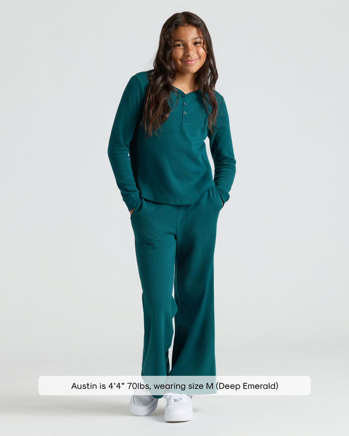 Child wearing Girls Deep Emerald Waffle Wide Leg Pants with henley top.