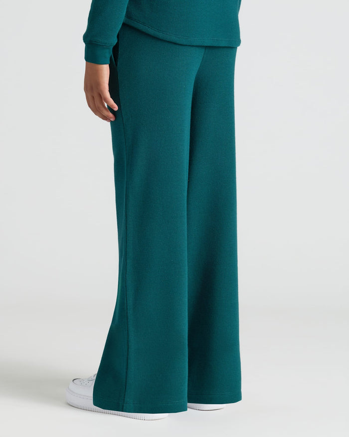 Girls Deep Emerald Waffle Long Sleeve Henley & Pants set with sneakers.