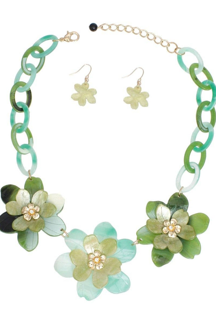 Marbled green acrylic resin collar necklace with chunky oval links, oversized 3D flower details, gold centers, and matching flower drop earrings.