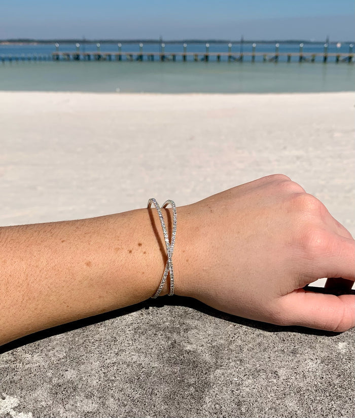 Kara crossover bracelet silver on model.