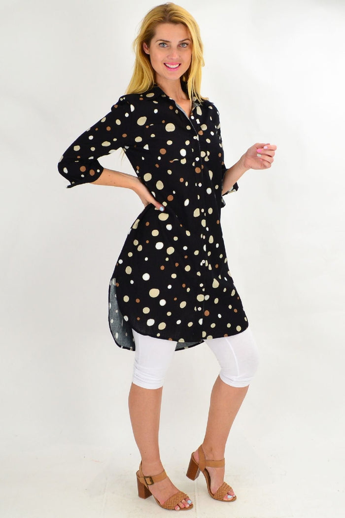Long black spot tunic shirt from Ruby Rain featuring a flowy silhouette and stylish pattern, perfect for casual or dressy wear.