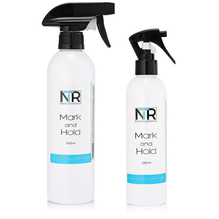 White spray bottle with black nozzle.