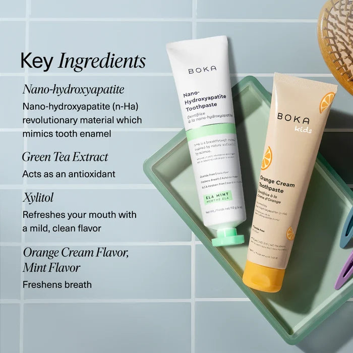 Boka toothpaste tubes on a textured towel with mint leaves, alongside key ingredients listed