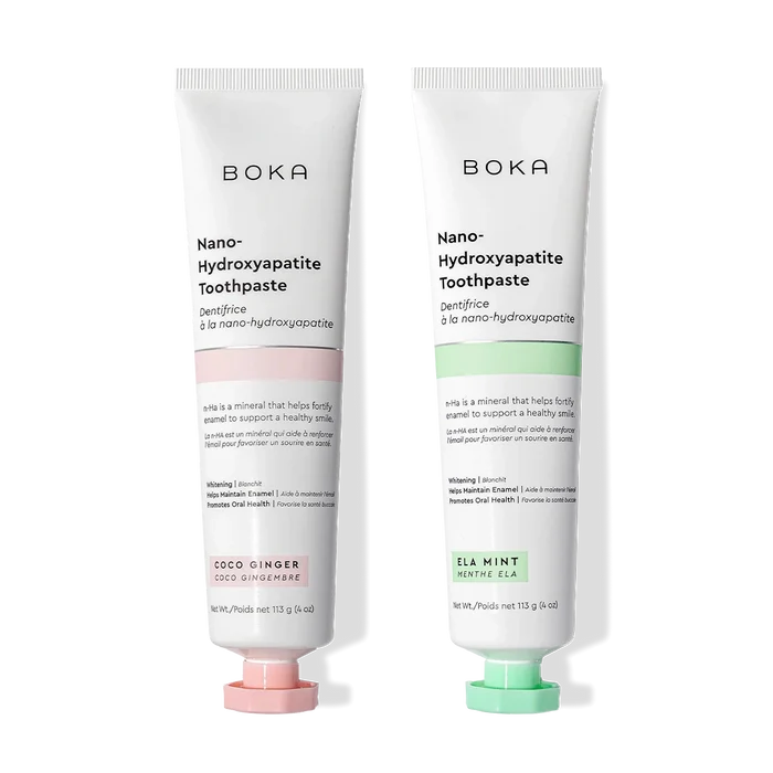N-Ha Toothpaste 2-Pack—Coco Ginger and Ela Mint—to remineralize teeth on a black background.