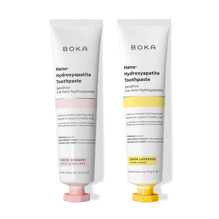 N-Ha Toothpaste 2-Pack—Coco Ginger and Lemon Lavender—fortifies enamel on a black background.