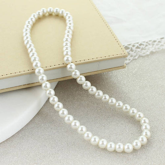 Classic imitation pearl stretch necklace displayed on a neutral background.
