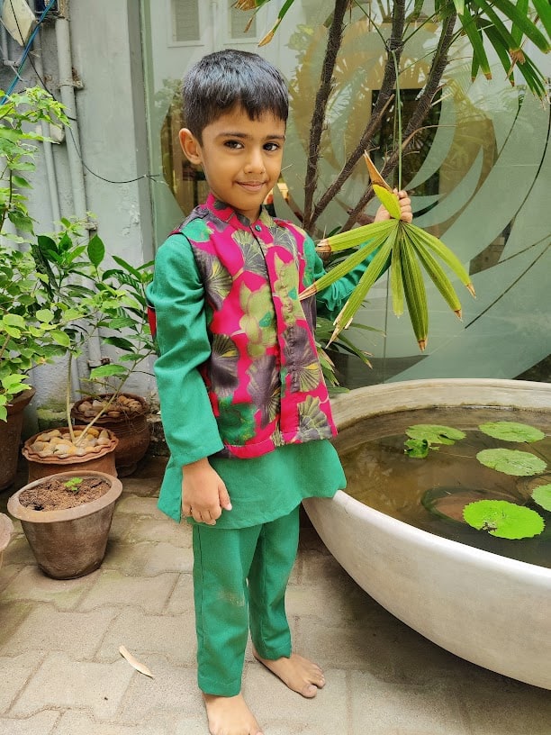 Pink printed satin coat with green kurta and pants