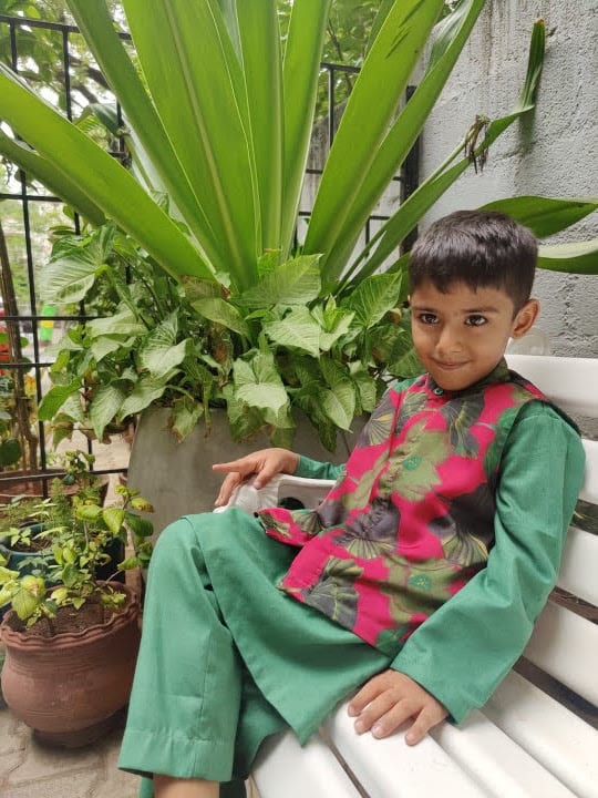 Pink printed satin coat with green kurta and pants