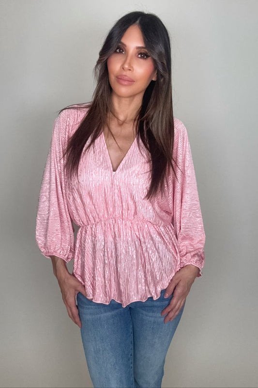 Pink V-neck crinkle satin long sleeve blouse with a paisley print and waist-defining silhouette.