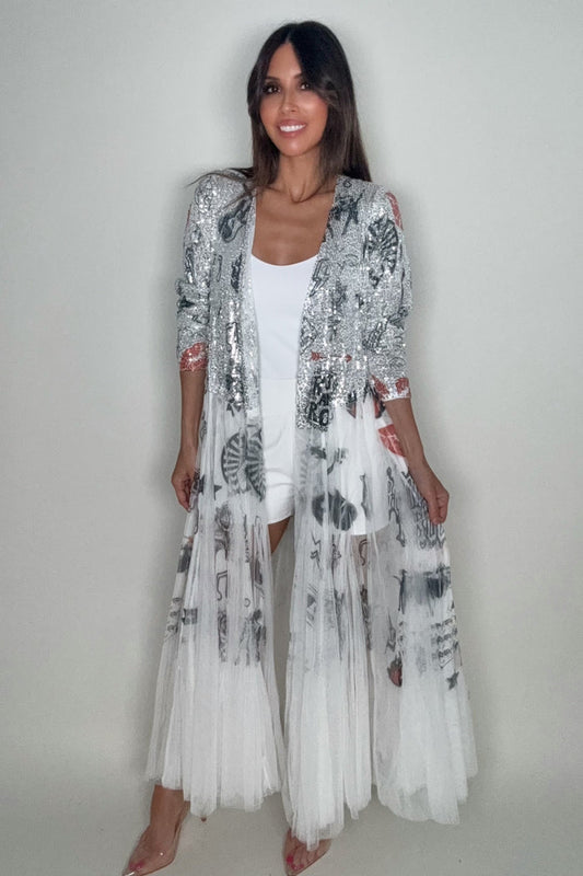 Metallic silver Rock and Roll sequin duster jacket with an open front, full sleeves, and sheer white tulle longline hem.