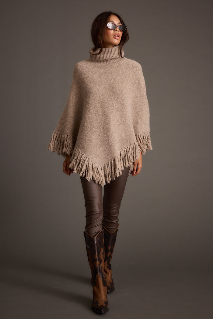 Back view of the sweater showing the silhouette and fit.