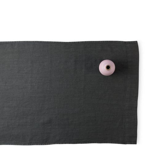R+D.LAB tela runner in dark gray linen with heath ceramics bud vase in wildflower