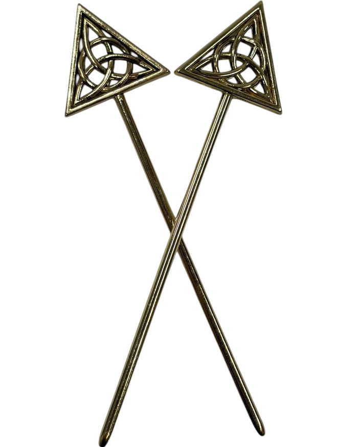 Gold-tone Unity Hair Sticks with Celtic knot triangle design, decorative metal hair pins crossed in front view for buns, updos, and elegant hairstyles.