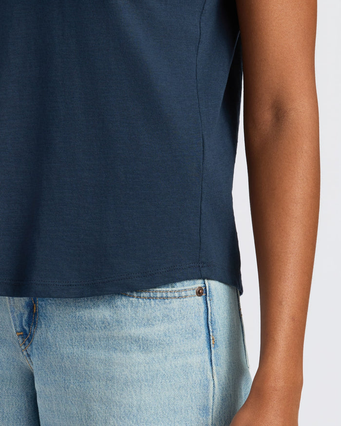 Womens Navy Relaxed Slub V-Neck Tee with light-washed jeans.