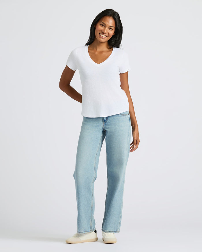 Person modeling Womens Black & White Relaxed Slub V-Neck Tee 4-Pack.